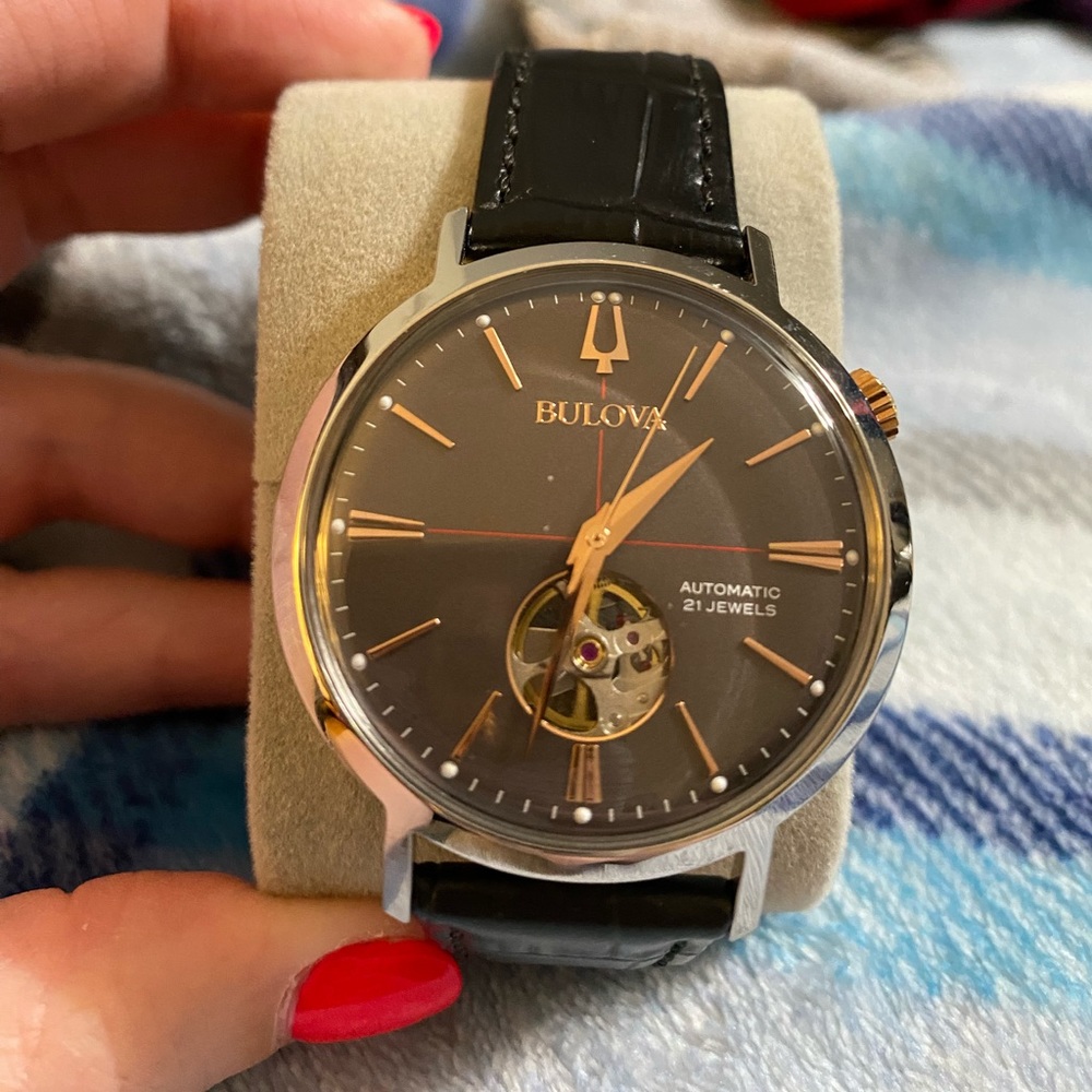 This is a small face black Aerojet automatic 21 Jewels Bulova men’s watch.
